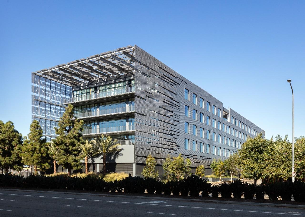 Perforated metal façade wrapping a six-storey office block