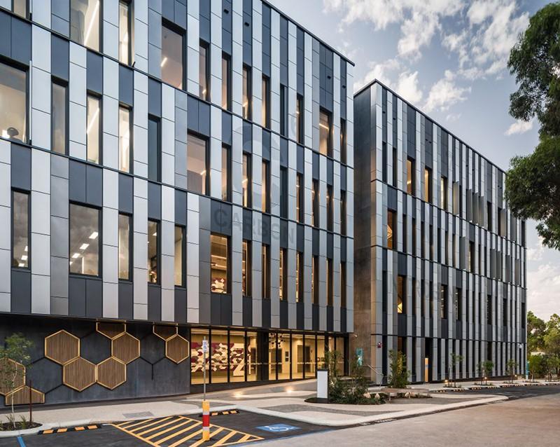 Direct-fix façade panels installed across a building elevation